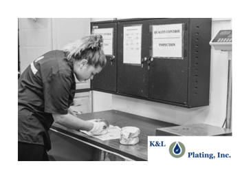 K&L Plating employee performing a quality inspection on the product.